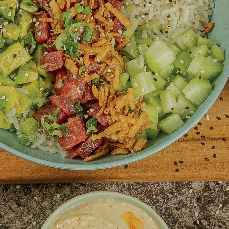 Tuna poke bowl with fresh tuna, avocado, cucumber and crispy onions