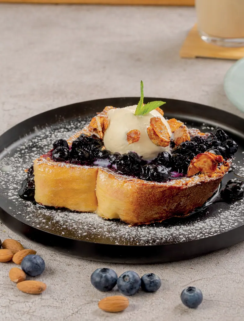 Blueberry-lemon French toast with vanilla ice cream, blueberry jam and candied almonds