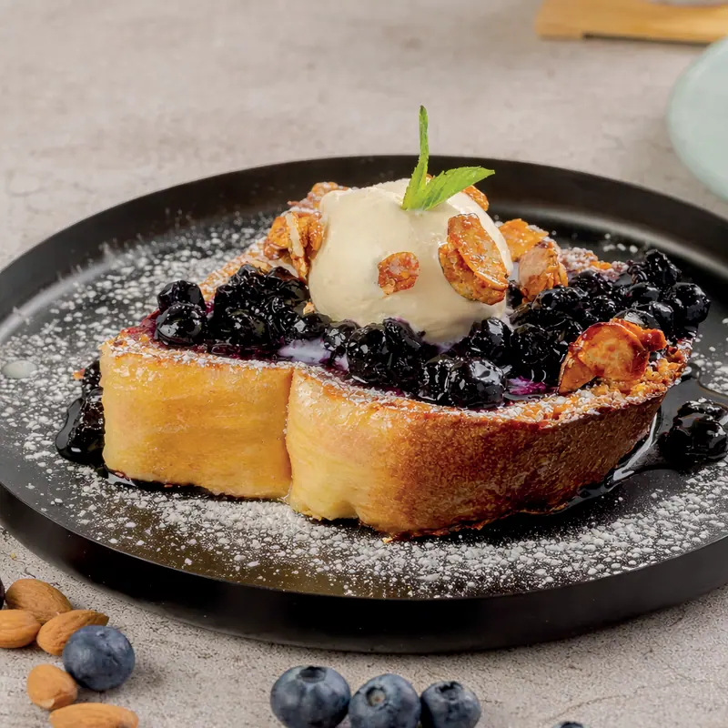 Blueberry-lemon French toast with vanilla ice cream, blueberry jam and candied almonds