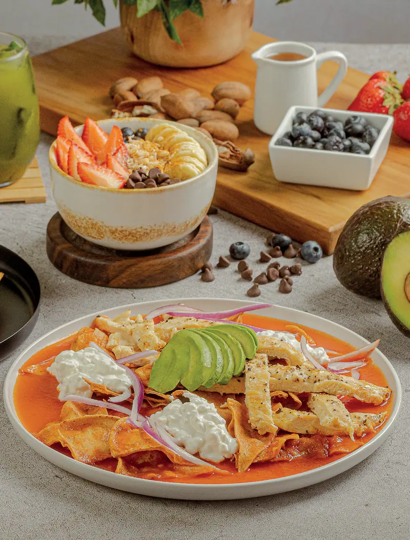 Oat and grain bowl with fruit, and fit chilaquiles with cottage cheese and avocado